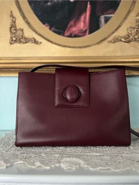 Cartier “Must de Cartier” Bordeaux Leather Shoulder bag in pristine condition.